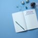 A diary with 2026 written on it against a blue background